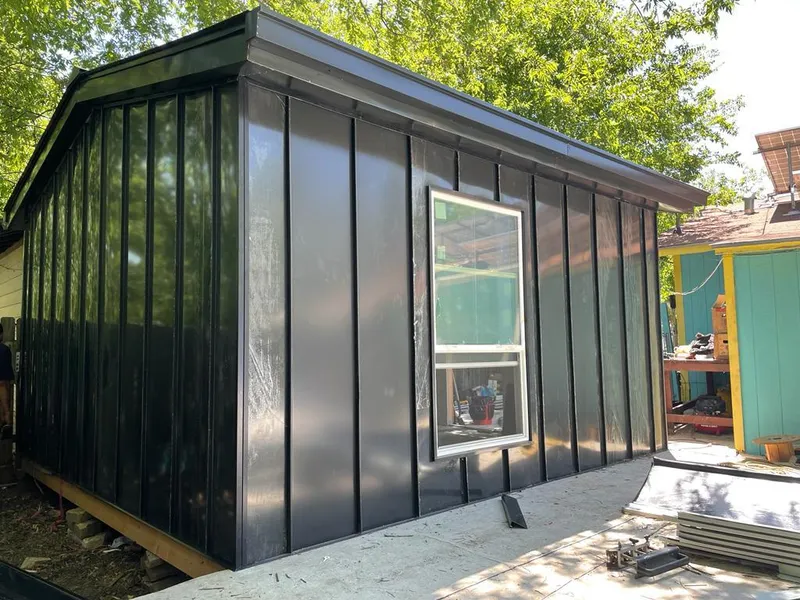 Black standing seam metal wall panels for Roof Inspection in Port Neches